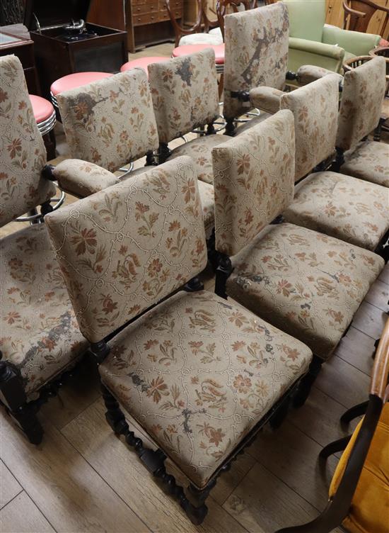 A set of eight Victorian oak upholstered dining chairs (two having arms)